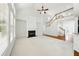 Bright and airy living room featuring a fireplace, hardwood flooring, and a vaulted ceiling at 12554 Huntington Trce, Alpharetta, GA 30005
