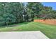 This back yard is spacious and has a fire pit area at 1610 Windsong Park Dr, Dacula, GA 30019