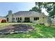 Beautiful backyard with landscaped planting bed and lush green grass, perfect for outdoor enjoyment at 1610 Windsong Park Dr, Dacula, GA 30019