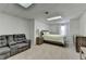 This basement bedroom has a comfortable sitting area at 1610 Windsong Park Dr, Dacula, GA 30019