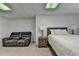 This finished basement has a bedroom, a sofa, and new carpet at 1610 Windsong Park Dr, Dacula, GA 30019