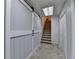 This basement hallway features a sliding barn door and a staircase at 1610 Windsong Park Dr, Dacula, GA 30019
