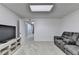 This basement living room has new carpet, neutral walls, and a media center at 1610 Windsong Park Dr, Dacula, GA 30019