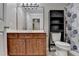 Well-lit bathroom featuring a wood vanity with a large mirror and a shower with a blue patterned curtain at 1610 Windsong Park Dr, Dacula, GA 30019