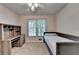 A carpeted bedroom featuring a built-in bed and a wooden desk for an efficient workspace at 1610 Windsong Park Dr, Dacula, GA 30019
