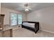 A carpeted bedroom featuring a built-in bed and a wooden dresser for storage at 1610 Windsong Park Dr, Dacula, GA 30019