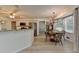 Bright dining area featuring a round table, natural light, and access to the kitchen at 1610 Windsong Park Dr, Dacula, GA 30019