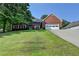 Charming brick home with a well-manicured lawn and attached two-car garage at 1610 Windsong Park Dr, Dacula, GA 30019