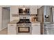 Well-equipped kitchen with stainless steel appliances, granite counters, and ample cabinet space at 1610 Windsong Park Dr, Dacula, GA 30019