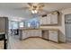 Open kitchen featuring granite countertops, stainless steel appliances, and a breakfast nook at 1610 Windsong Park Dr, Dacula, GA 30019