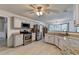 Spacious kitchen with stainless steel appliances, white cabinets, and granite countertops at 1610 Windsong Park Dr, Dacula, GA 30019