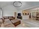 Living room featuring wood floors, a fireplace, and open access to the kitchen at 1610 Windsong Park Dr, Dacula, GA 30019
