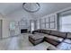 Bright living room featuring a fireplace, vaulted ceilings, and large windows at 1610 Windsong Park Dr, Dacula, GA 30019