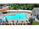 Resort-style pool with lounge chairs and umbrellas, perfect for relaxation and summertime fun at 1610 Windsong Park Dr, Dacula, GA 30019