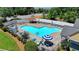 Resort-style pool with lounge chairs and umbrellas, perfect for relaxation and summertime fun at 1610 Windsong Park Dr, Dacula, GA 30019