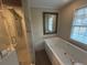 Bathroom featuring a jetted tub and a separate shower at 3808 Holy Cross Ct, Decatur, GA 30034