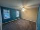 Spacious bedroom with two windows, ceiling fan and neutral color scheme at 3808 Holy Cross Ct, Decatur, GA 30034