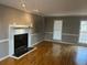 Spacious living room with a fireplace and hardwood flooring at 3808 Holy Cross Ct, Decatur, GA 30034