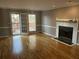 Spacious living room with a fireplace and hardwood flooring at 3808 Holy Cross Ct, Decatur, GA 30034