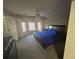 Large main bedroom featuring a bay window and a ceiling fan at 3808 Holy Cross Ct, Decatur, GA 30034