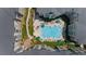 An aerial view of a resort-style apartment complex featuring a pool, lounge chairs, and well-maintained landscaping at 800 Peachtree Ne St # 1504, Atlanta, GA 30308