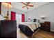 Bright bedroom with hardwood floors, ceiling fan, and modern bedding decor at 800 Peachtree Ne St # 1504, Atlanta, GA 30308