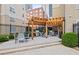 Community grill area with gas grills, tables and chairs, and pergola at 800 Peachtree Ne St # 1504, Atlanta, GA 30308