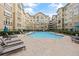 Community pool with lounge chairs and courtyard views at 800 Peachtree Ne St # 1504, Atlanta, GA 30308