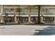Exterior street view of a commercial building featuring various businesses and retail shops at 800 Peachtree Ne St # 1504, Atlanta, GA 30308