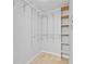 Empty walk-in closet with shelving, tiled floors and hanging racks at 800 Peachtree Ne St # 1504, Atlanta, GA 30308