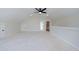 Bonus room with a ceiling fan, a door to a bathroom, and hard surface flooring at 160 South Village Ave, Holly Springs, GA 30115