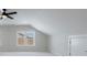 Bonus room with two windows, carpet, and a ceiling fan at 160 South Village Ave, Holly Springs, GA 30115