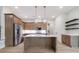 Bright, spacious kitchen with stainless steel appliances, ample cabinets and kitchen island at 160 South Village Ave, Holly Springs, GA 30115