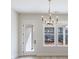 Living room with a chandelier and many windows at 160 South Village Ave, Holly Springs, GA 30115