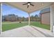 Covered patio overlooking a large green lawn at 160 South Village Ave, Holly Springs, GA 30115