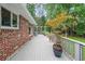 Spacious deck with brick siding and lush greenery at 2889 Mount Olive Dr, Decatur, GA 30033