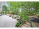 Expansive deck surrounded by lush trees, providing a serene outdoor living space at 2889 Mount Olive Dr, Decatur, GA 30033