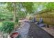 Picturesque backyard with lush landscaping, stone pathway, and seating area at 2889 Mount Olive Dr, Decatur, GA 30033
