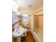 Well-lit bathroom with a combined tub and shower and ample storage space at 2889 Mount Olive Dr, Decatur, GA 30033