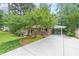 This home boasts a spacious driveway with a carport, perfect for protecting your vehicles from the elements at 2889 Mount Olive Dr, Decatur, GA 30033
