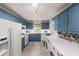Functional kitchen and laundry room combination offering great efficiency and convenience for everyday tasks at 2889 Mount Olive Dr, Decatur, GA 30033