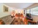 Inviting living room featuring gleaming hardwood floors and a large window offering lots of natural light at 2889 Mount Olive Dr, Decatur, GA 30033