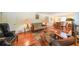 Cozy living room featuring gleaming hardwood floors and large windows offering lots of natural light at 2889 Mount Olive Dr, Decatur, GA 30033