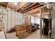 Unfinished basement with exposed wood beams and insulation, and a foosball table at 344 Nottingham Dr, Marietta, GA 30066