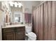Bathroom with dark wood vanity, granite counters, and shower with curtain at 344 Nottingham Dr, Marietta, GA 30066