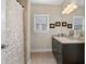 Well-lit bathroom features a vanity with plenty of counter space and decorative details at 344 Nottingham Dr, Marietta, GA 30066
