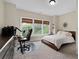 Bedroom with large windows, a queen bed, and a built-in desk for the perfect office space at 344 Nottingham Dr, Marietta, GA 30066