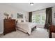 Comfortable bedroom with natural light and classic furnishings at 344 Nottingham Dr, Marietta, GA 30066