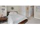 Bright bedroom featuring a comfortable bed, a side table, and white trim creating a cozy space at 344 Nottingham Dr, Marietta, GA 30066