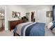 Bedroom features a dresser, large window, and view to hall at 344 Nottingham Dr, Marietta, GA 30066